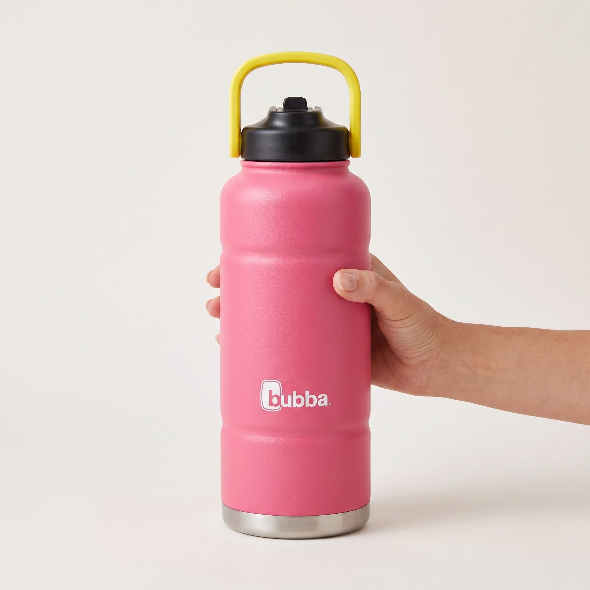 bubba 40 oz Trailblazer insulated bottle in Azalea with straw lid held in an adult hand, showing its real size. It stands 11.22 in tall.