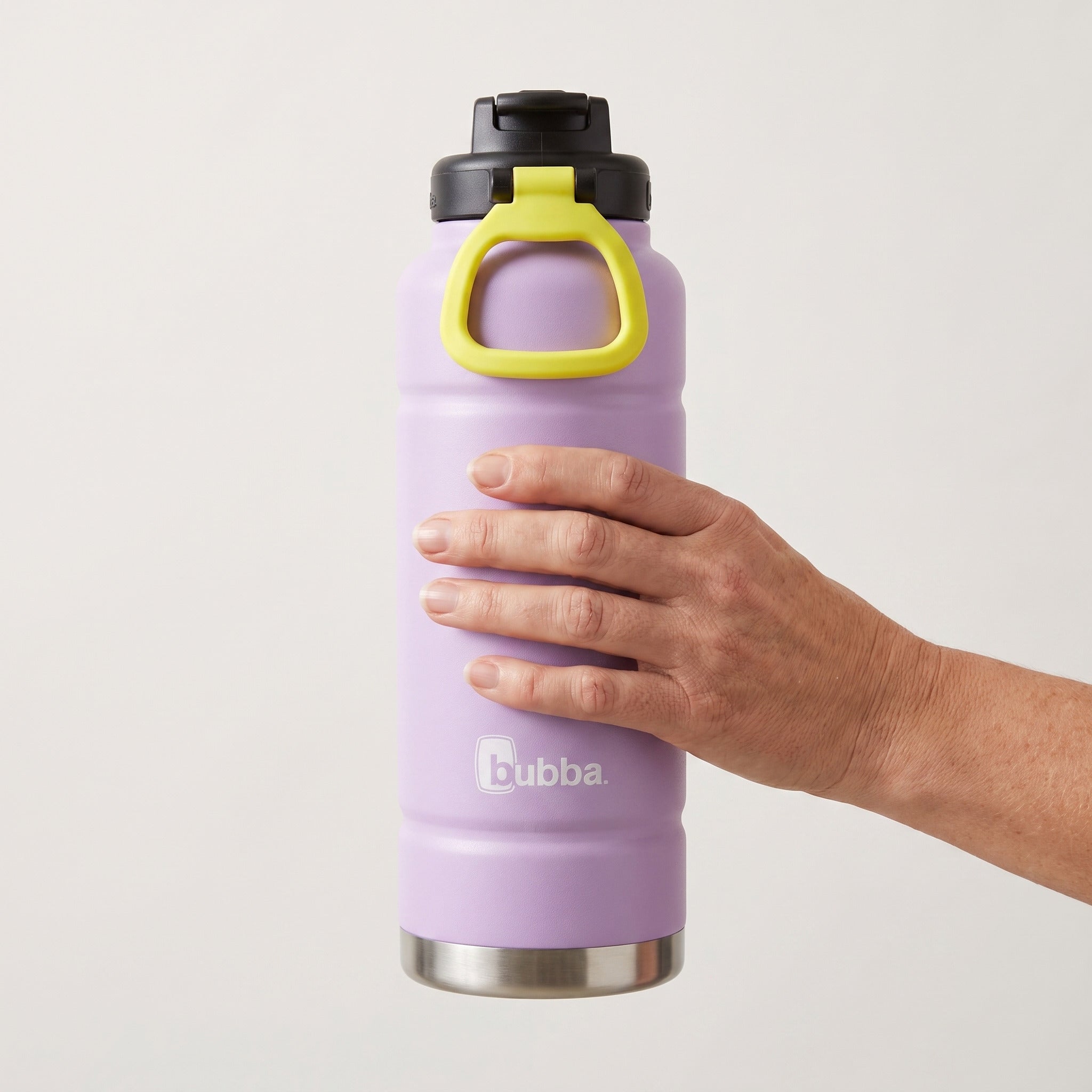 bubba 40 oz Trailblazer insulated bottle in Lavender Frost with straw lid held in an adult hand, showing its real size. It stands 11.22 in tall.