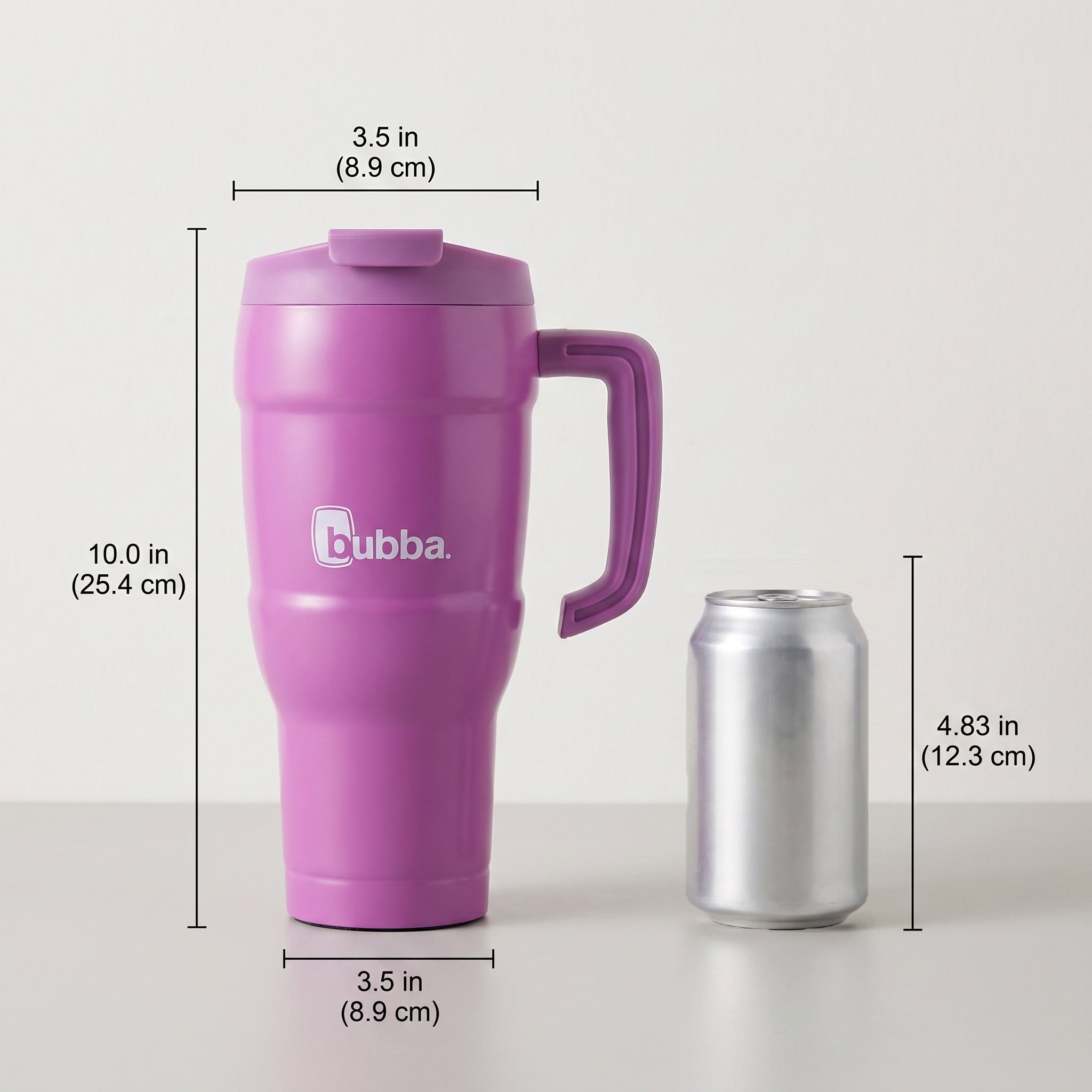 bubba 24 oz Hero XL Tumbler in Magenta/Galactic standing beside a 355 ml can for size comparison. It stands 10.0 in tall.