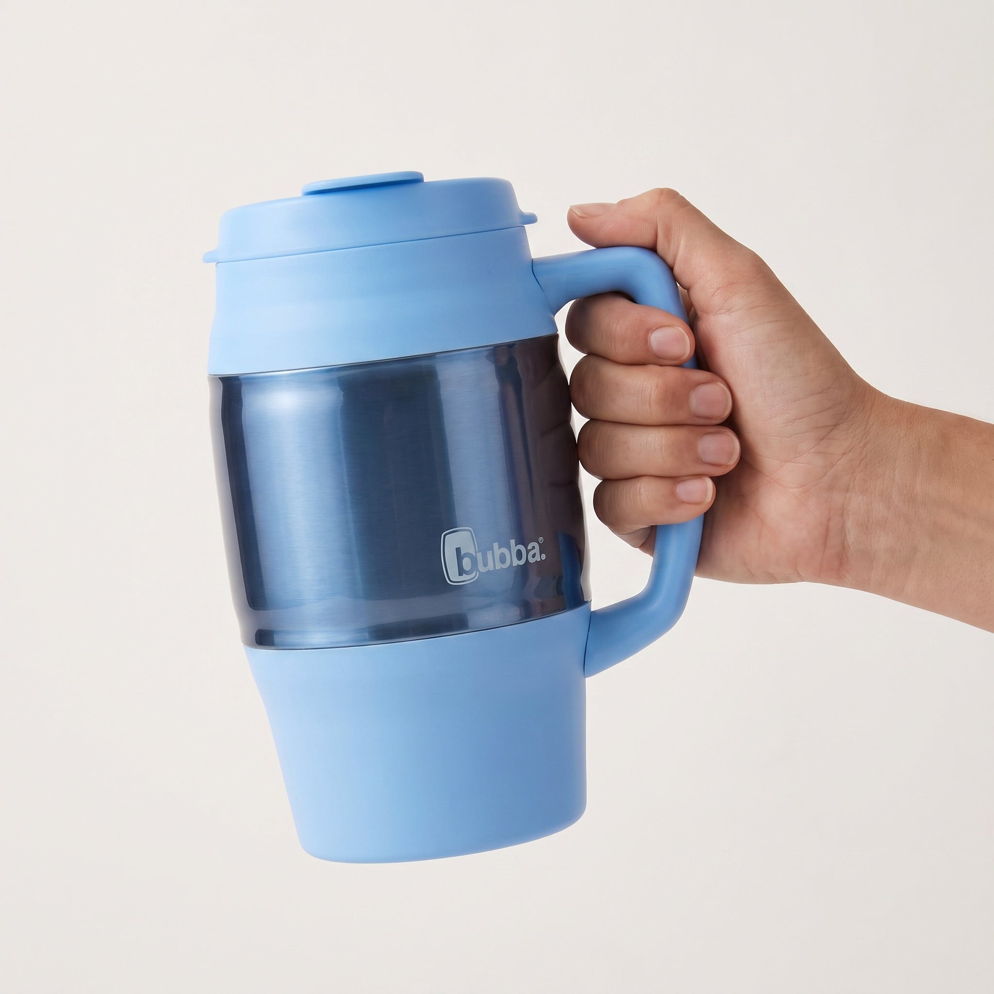 bubba 34 oz Classic Mug in Daydream held in an adult hand, showing its real size. It stands 7.88 in tall.
