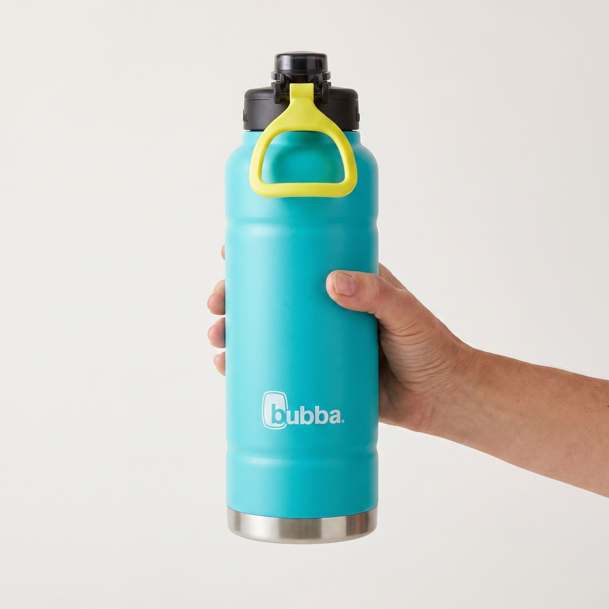 bubba 40 oz Trailblazer insulated bottle in Scuba held in an adult hand, showing its real size. It stands 11.22 in tall.