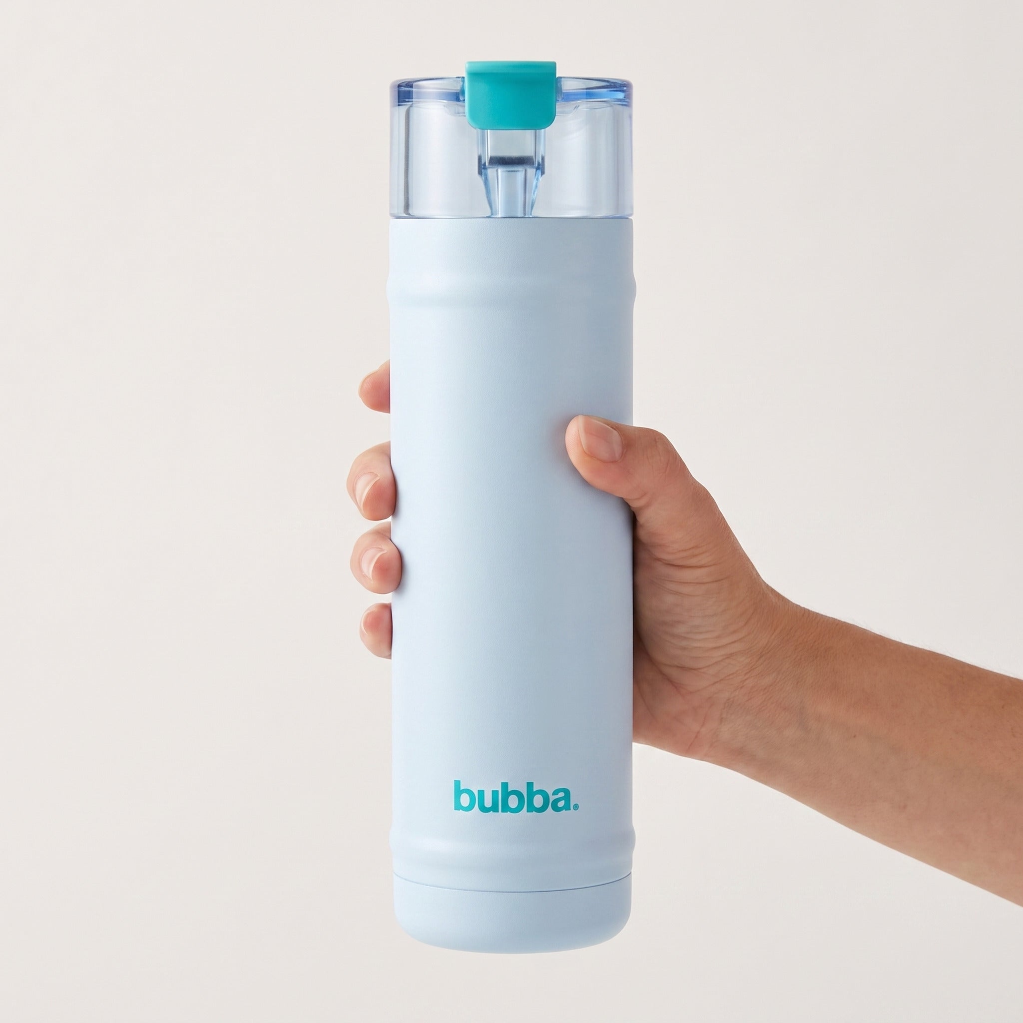 bubba 24 oz DualSip insulated bottle in Daydreamin' held in an adult hand, showing its real size. It stands 10.79 in tall.