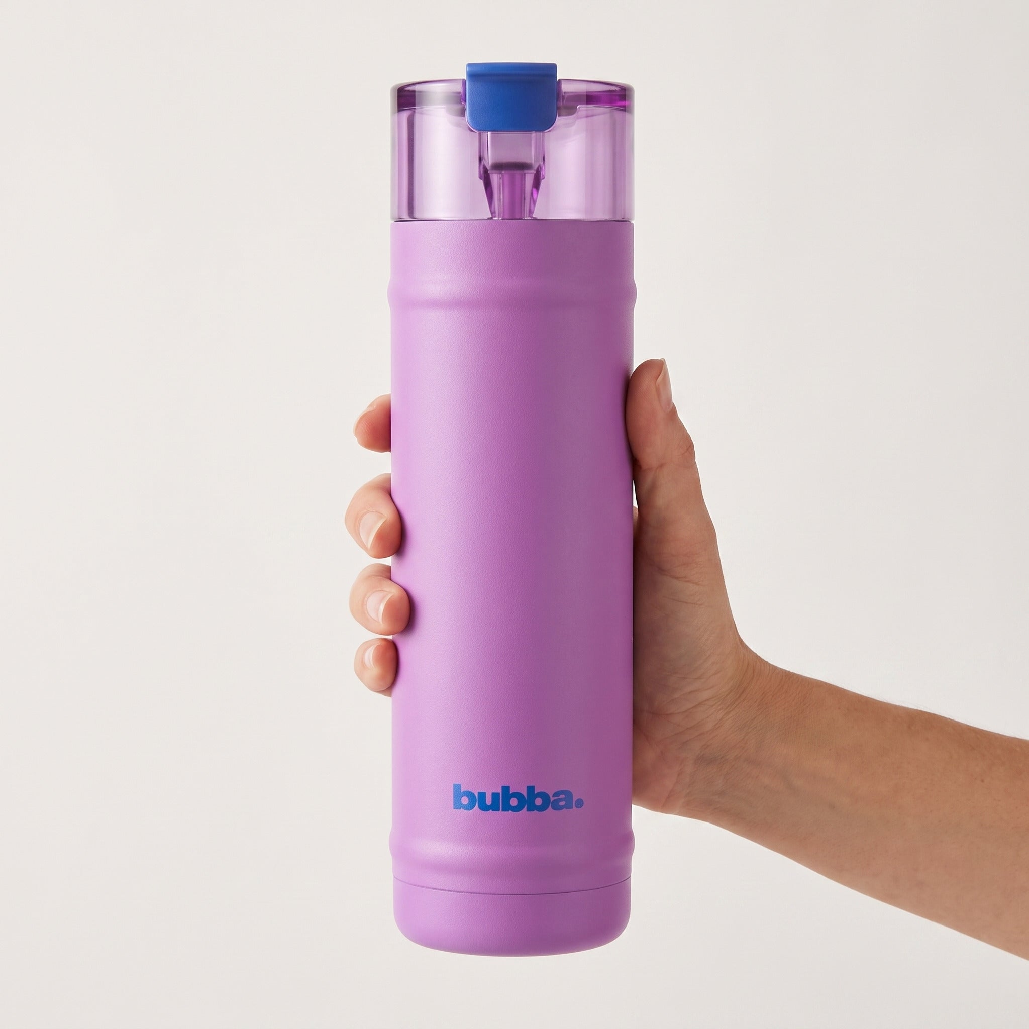 bubba 24 oz DualSip insulated bottle in Moodbooster held in an adult hand, showing its real size. It stands 10.79 in tall.