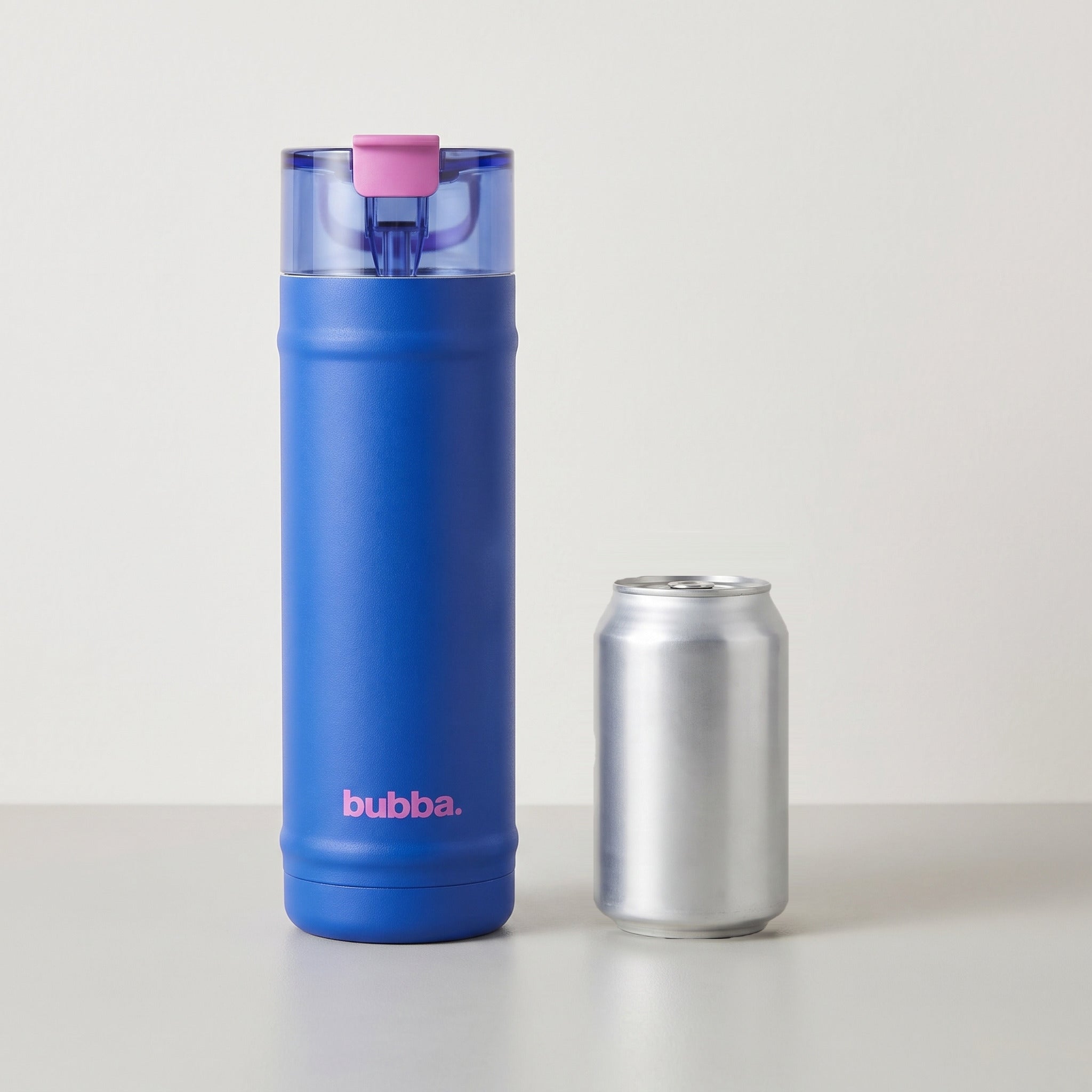 bubba 24 oz DualSip insulated bottle in Ocean Energy standing beside a 355 ml can for size comparison. It stands 10.79 in tall.
