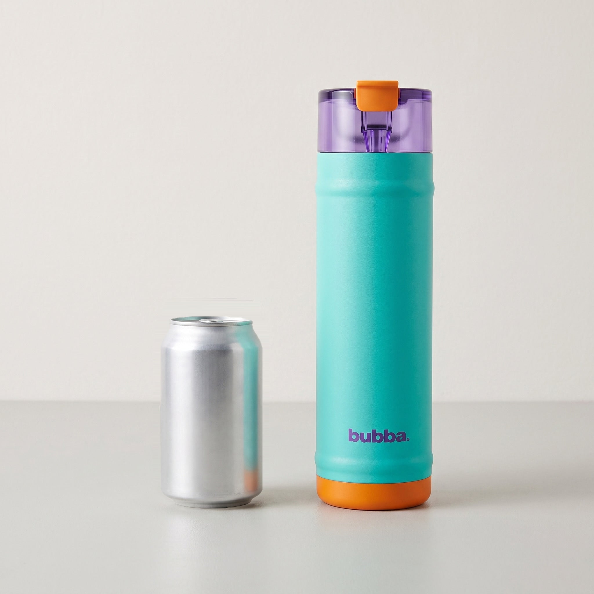 bubba 24 oz DualSip insulated bottle in Field Trip standing beside a 355 ml can for size comparison. It stands 10.79 in tall.
