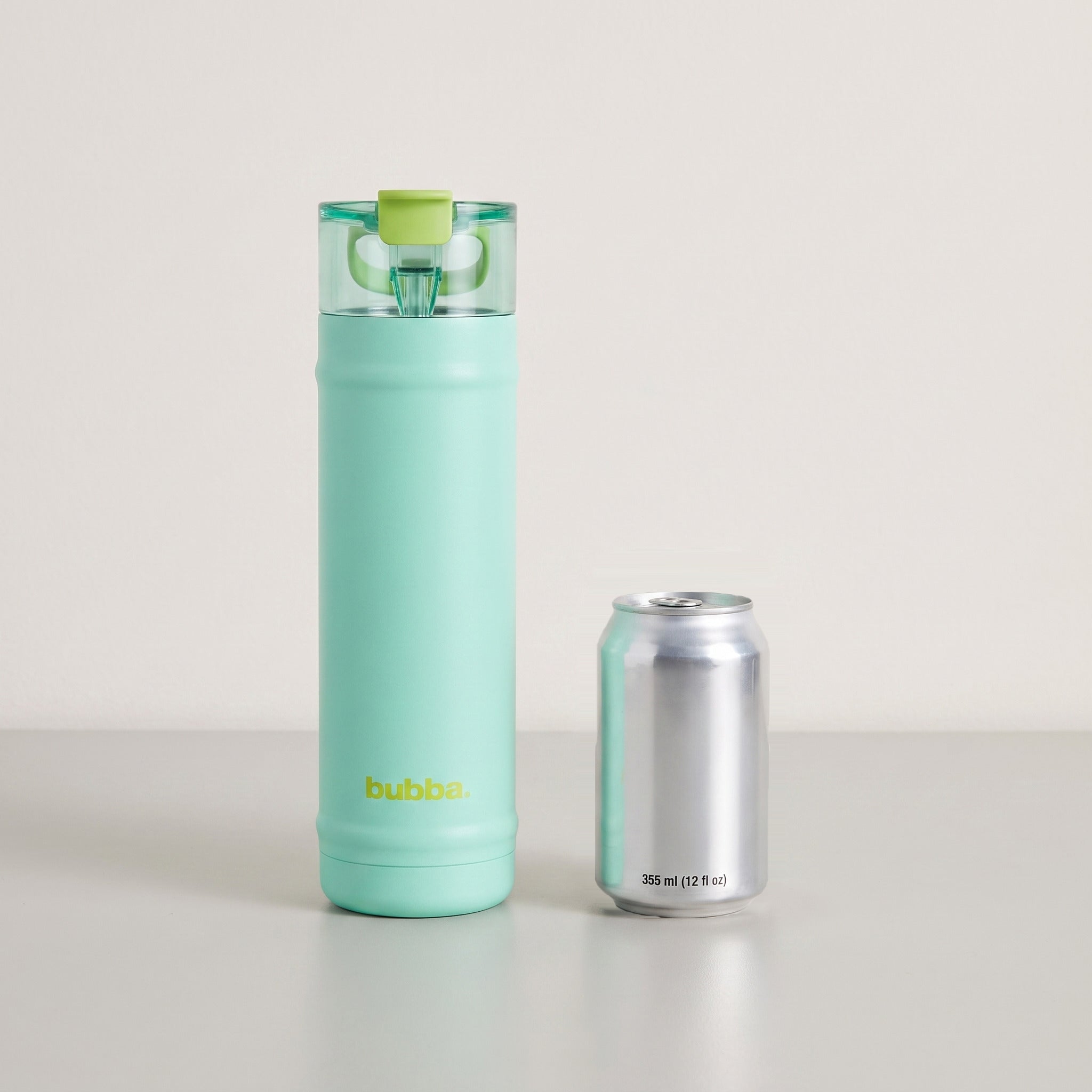 bubba 24 oz DualSip insulated bottle in Tropical Eclipse standing beside a 355 ml can for size comparison. It stands 10.79 in tall.
