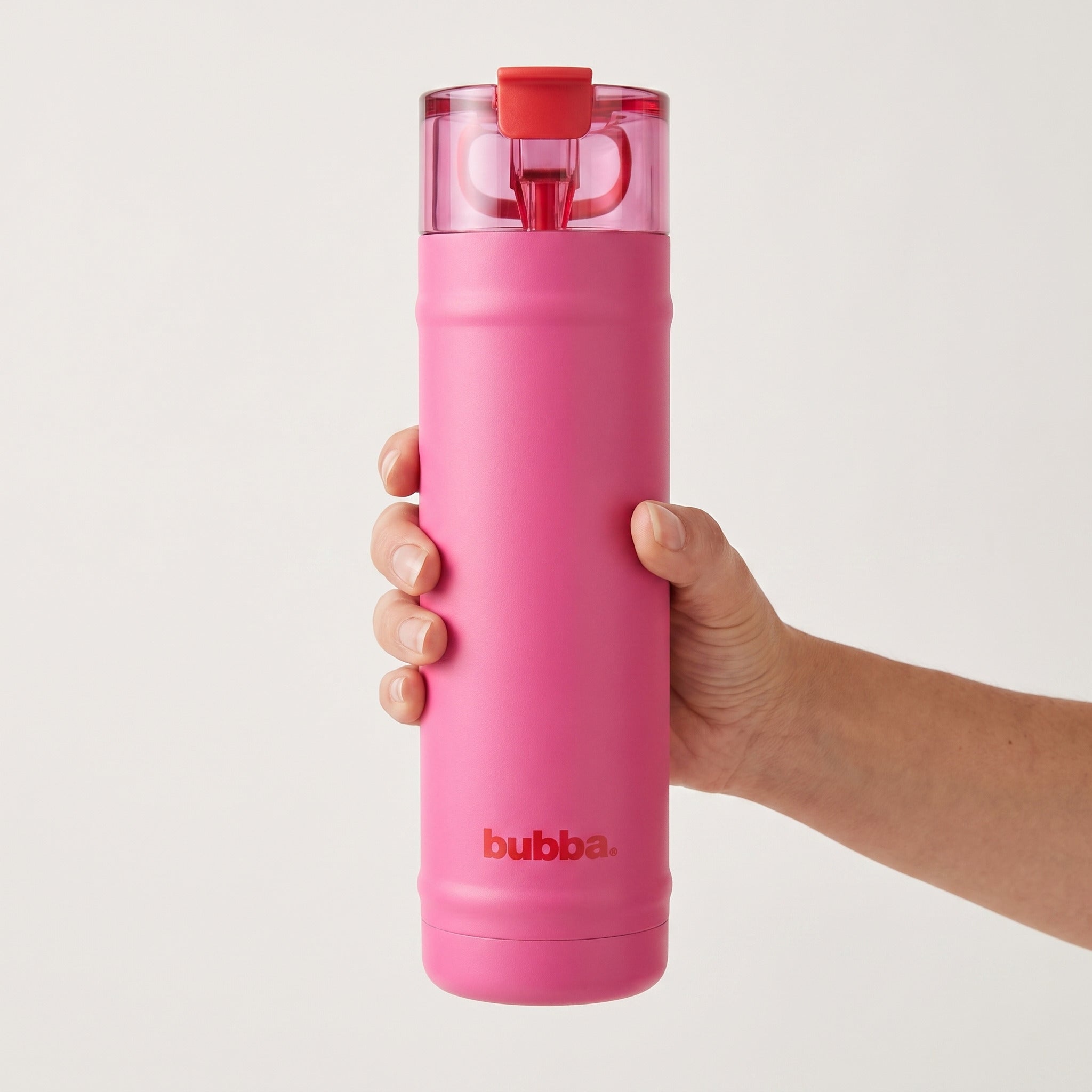 bubba 24 oz DualSip insulated bottle in Flora Aura held in an adult hand, showing its real size. It stands 10.79 in tall.