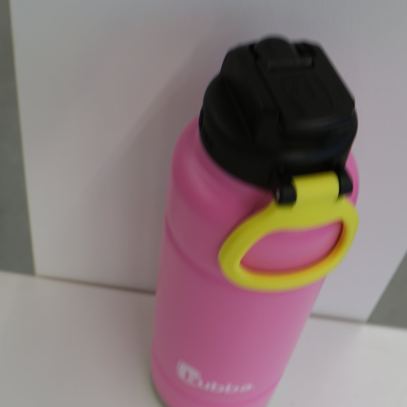 bubba 40 oz Trailblazer in Azalea pink on its side, showing the lid and yellow carry loop