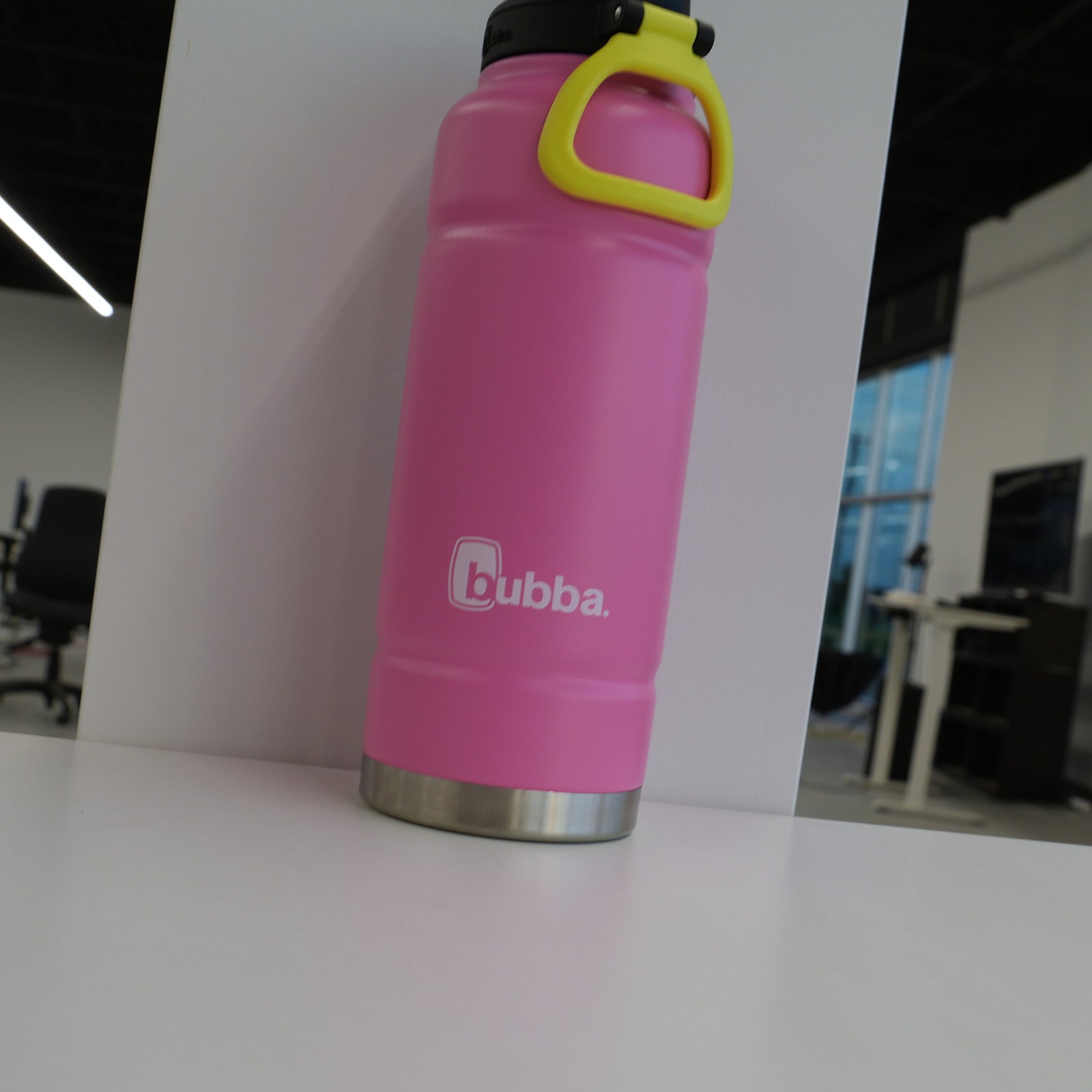 bubba 40 oz Trailblazer insulated bottle in Azalea pink, upright with the lid closed and the yellow carry loop attached